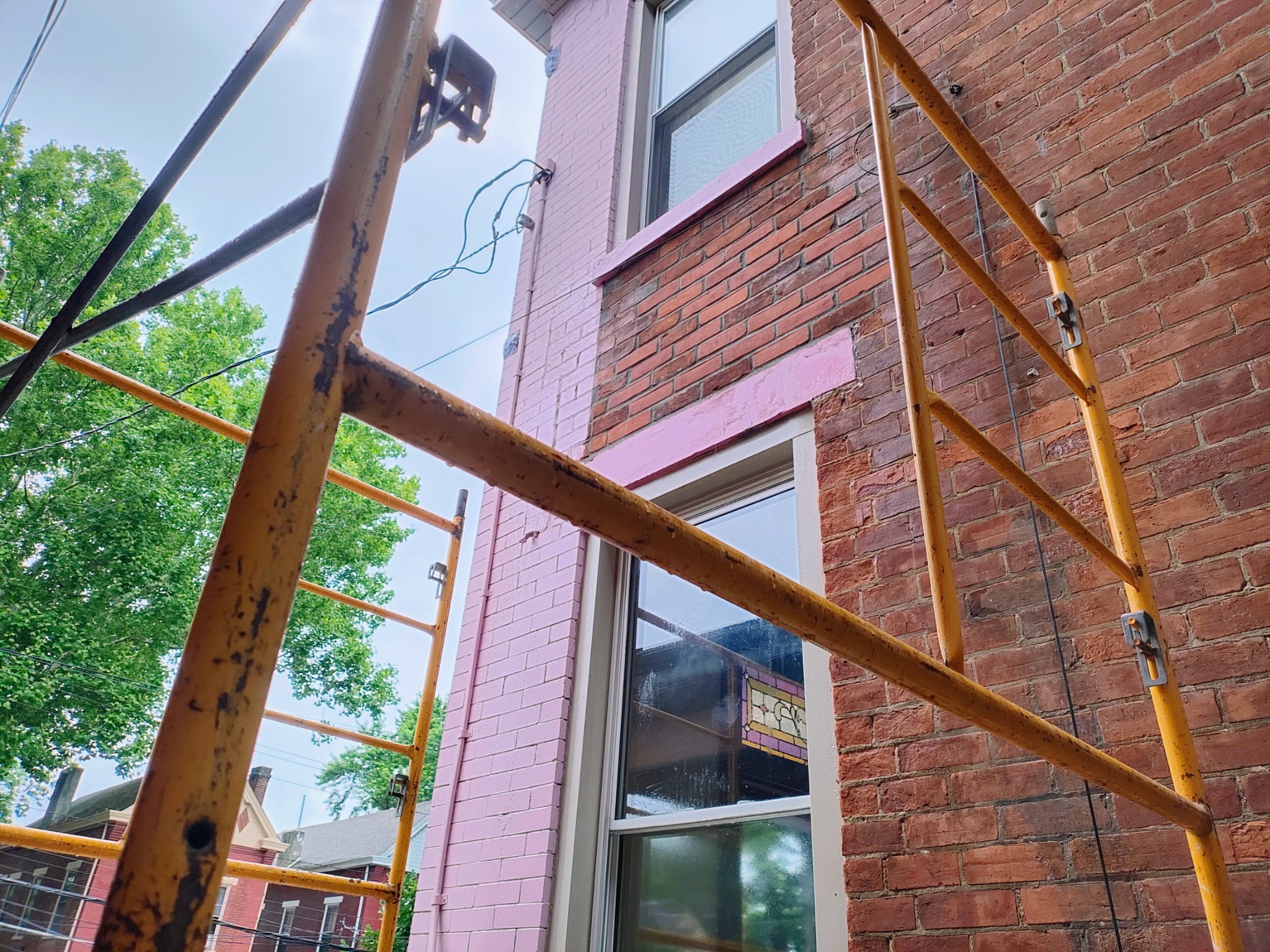 Completed historic brick reconstruction above window