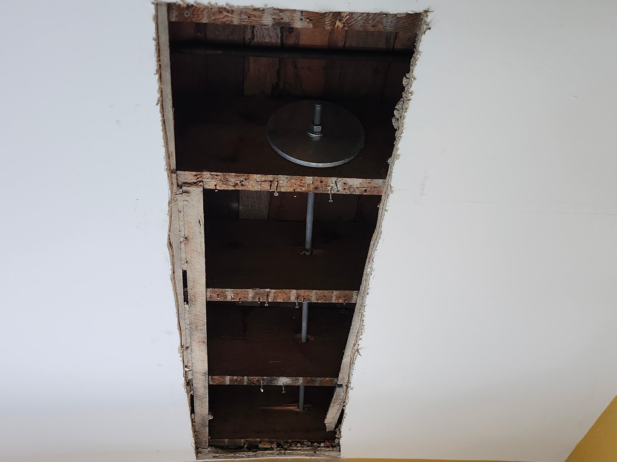 Interior bearing plate threaded rod and framing